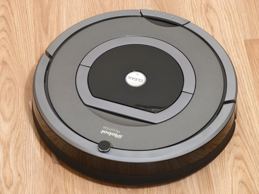 The robot vacuum cleaner on the right must operate independently in uncontrolled environments.