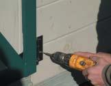Installing lower siding boards Unscrew bottom door hinges