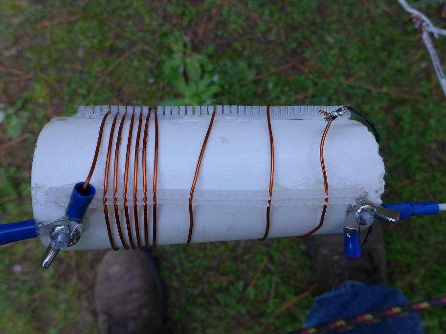 The 40 m coil. The coil form is a 2 diameter PVC pipe (63 mm outer diameter) with 2.54 mm spacing caterpillar grommet strips hot glued to the pipe to hold the magnet wire.