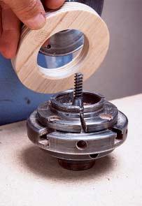 A turned washer broadens the face of a set of standard chuck jaws to provide a better grip for blanks above 6 in. (150mm) in diameter.