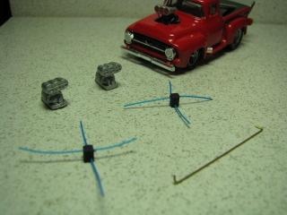 After I spray the block black, I cut a piece of thin blue wire around 3/4" long and glue them in place.