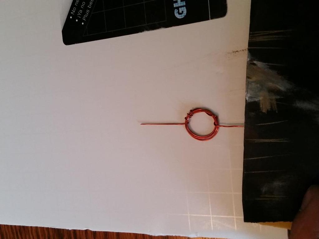 Next take 2 paper clips and slightly bend one end of each clip to