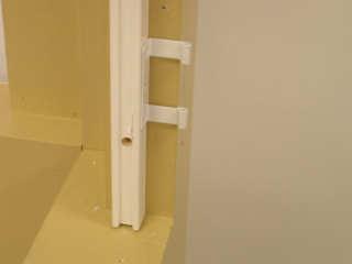 With hang strip properly positioned in the opening, insert screw in