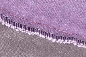 Serged seams A serged seam joins two pieces of material with a thread stitch that interlocks. A standard seam finish, serged seams are relatively easy to take apart.