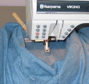 Bring the hooped part of the sleeve through the armhole, (hoop and all.