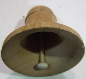 Bob Rosand s Christmas bell: 1. Secure a cherry blank 2 ¾ x 2 ¾ x 4 ½ inches long between centers and rough it into a cylinder. 2. Form a tenon on the headstock end and secure the blank in the #2 jaws.