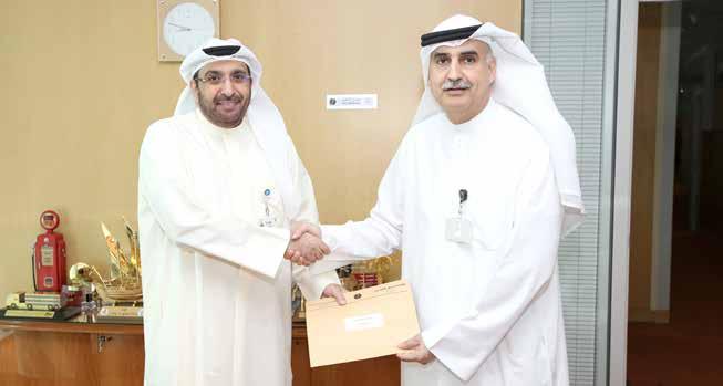 Former Well-Surveillance Manager Saeed Al-Shaheen with KPC CEO Nizar Al-Adsani.