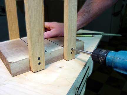 Pre-drill oak staves on bottom and fasten to base block as pictured.