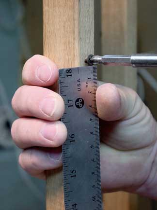 Photo#3 Pre-drill and countersink the center of the outside edge of the staves ¾" down from the top of the staves.