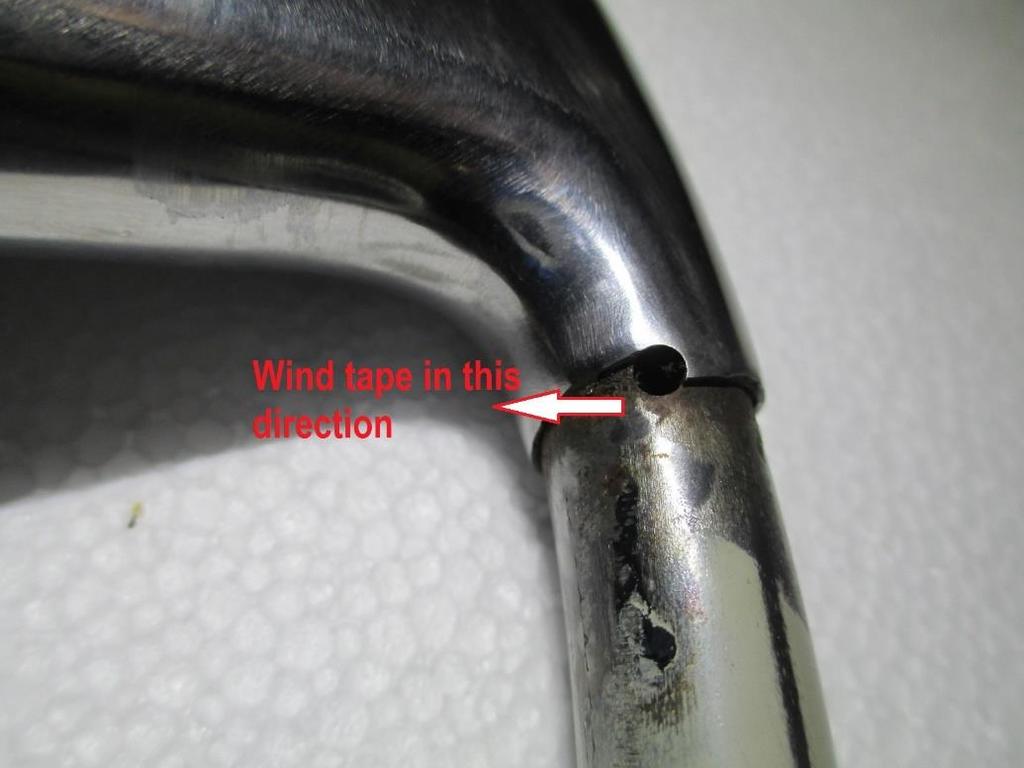 You will notice that the stainless steel part of the steering wheel spoke is shaped around the two holes which locate the ends of the binding tape and this dictates which direction the tape is to be