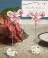 form a coiled place card holder behind the crystal butterfly. Place cards inc. 2.
