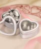 Each tin contains a small symbol, choose from wedding bells, cake or heart, may be different from