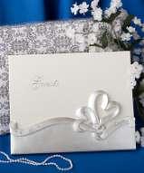 detailed/carved bride and groom appliqué on the cover with interior pages designed for your guests best wishes.