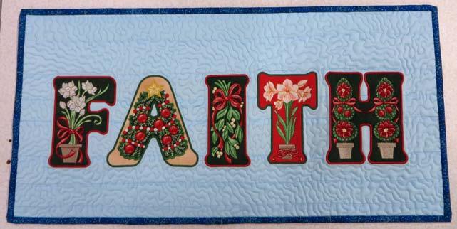 There are many possibilities to use with this collection that celebrates the Spirit of Christmas. The FAITH wallhanging showcases the large appliquéd letters on a strip pieced light blue background.