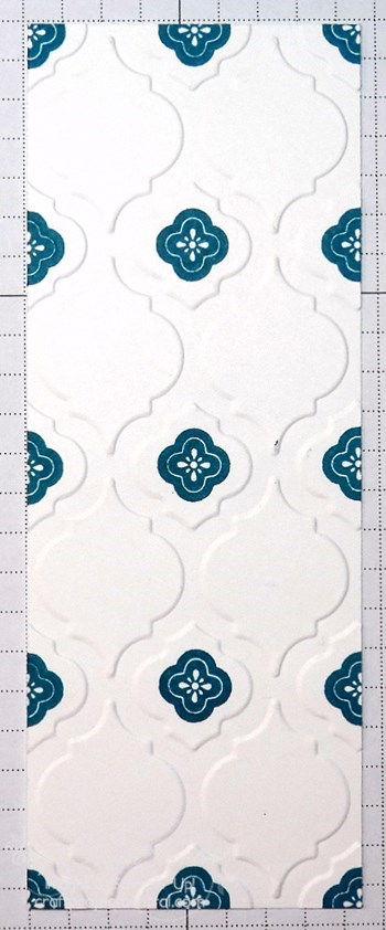 Emboss the 2-1/8 x 5-5/8 pieces of Whisper White card stock by running them through the Big Shot with the Modern Mosaic embossing folder, making sure both pieces have two columns of four large
