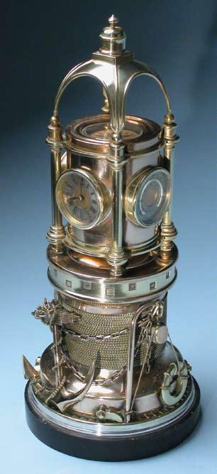159. SCARCE AND UNIQUE MECHANICAL BRASS, COPPER, AND SILVER MARINER S PRESENTATION CLOCK-BAROMETER, circa 1890, spring driven movement rotates the upper dome section housing two clocks, aneroid