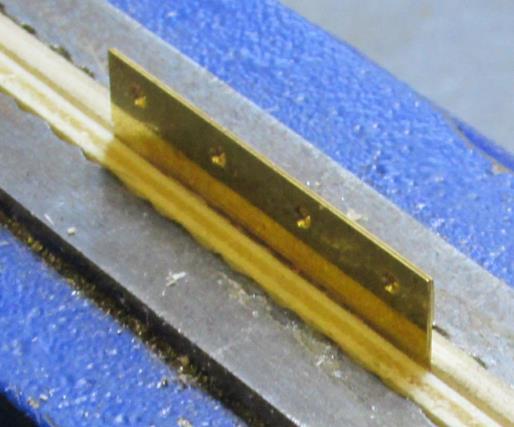 from the body fret) and place a corner plate along one edge with its fold line aligned with the plywood s edge.