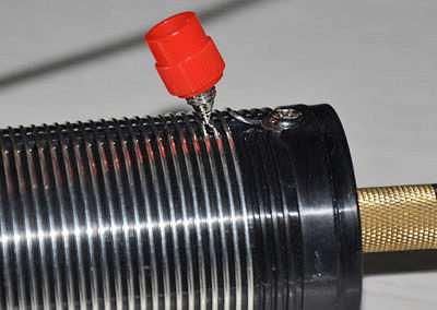 To tap a coil, loosen the plastic nut on the coil clip until it is very near the end of its travel, or remove the nut completely.
