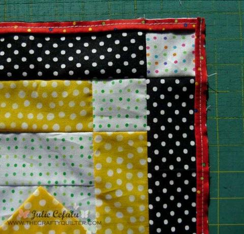 5. Add borders and corner squares. I always cut my borders to fit my quilt top, rather than sewing on a long strip of fabric and lopping off the excess.