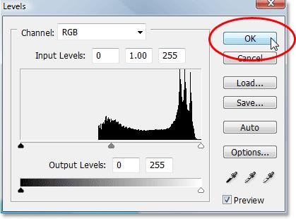 Click on the "New Adjustment Layer" icon and choose "Levels" from the list. When the Levels dialog box appears, I'm simply going to click OK in the top right corner to exit out of it.