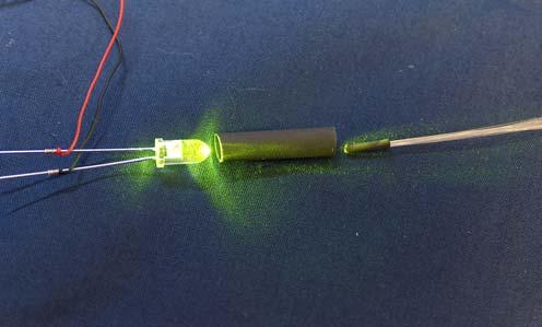 LED, and heatshrink tube, and fibers, ready to join. Fibers joined to LED with heatshrink tubing.
