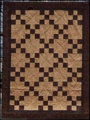 Measuring 48" square, this simple pieced design uses four different shades of each color going from very light to very dark to create each block.