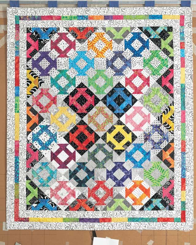 dash t o t h e corners Designer Susan Mayer pieced her quilt top with a straight, block-to-block setting, then creatively
