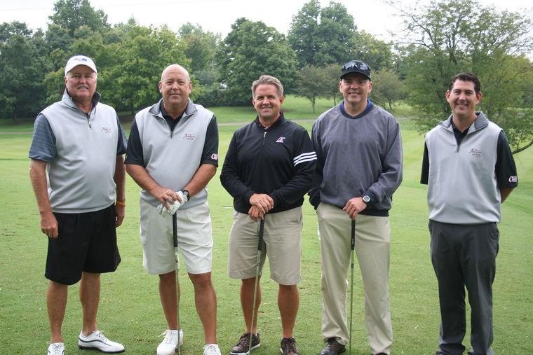 Page 7 At 10 a.m. Friday, September 12th, 18 teams teed up for a fundraising event at the Arlington Club.