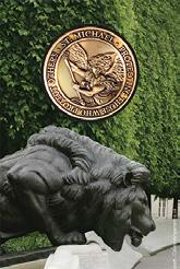 Shield logo on the front and a Memorial lion on the reverse.