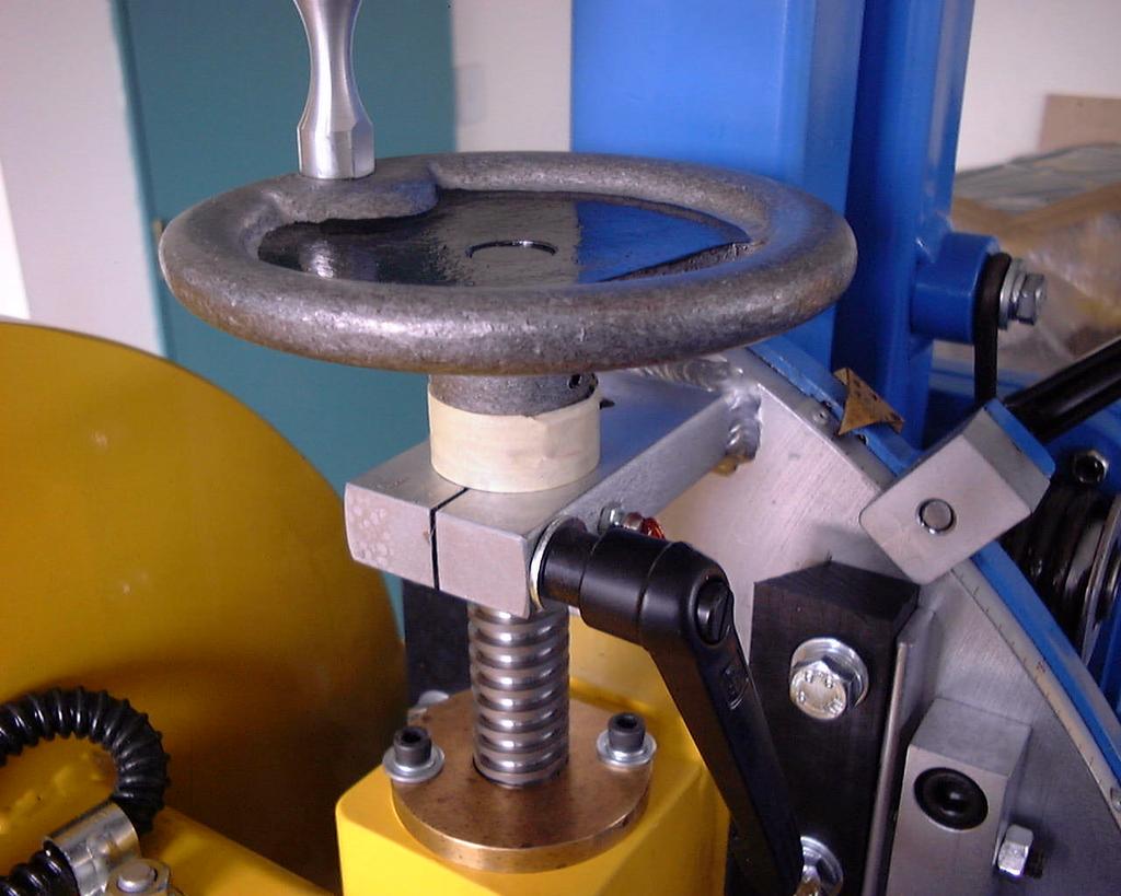 ADJUSTING THE DEPTH OF CUT CM SPIDA SAW OPERATION The depth of cut can be altered by loosening the black locking lever (Quick Clamp). Turning the hand wheel clockwise will raise the blade.