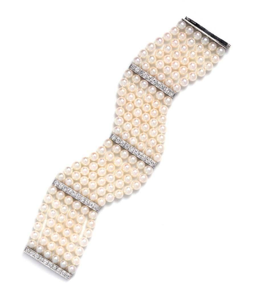 Sale 394 Lot 401 A Platinum, Cultured Pearl and Diamond Bracelet, Tiffany & Co., composed of six strands of pearls measuring approximately 5.60-6.