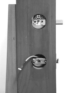 2. Be sure you start from the outside of the door with the Outside Section of the lock and feed cable to the inside through the second hole from the bottom. 3. EXTEND the deadbolt.
