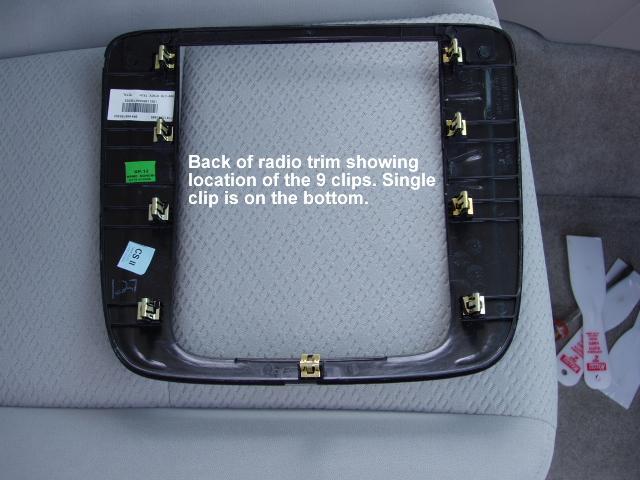 REMOVING THE RADIO BEZEL/TRIM PANEL Using a plastic trim removal tool or 2 plastic putty knives along with a