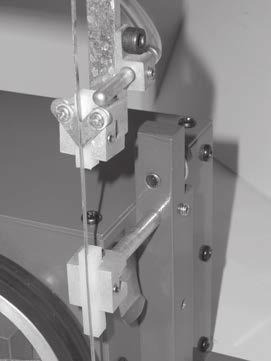 Once you have followed the Blade Installation directions (page 2, Section C), test the blade tension by doing the following: 1) Position the upper blade guide assembly to within 3/4 of the work table