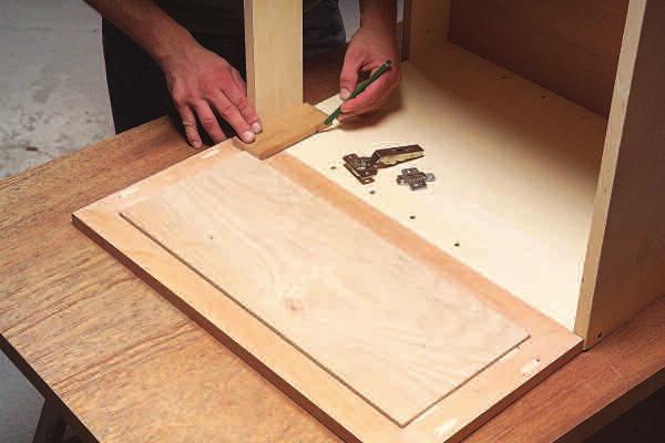 Miter the moldings and install them with glue and 1-1/4-in. brads. Throughout this project, use brads sparingly. Drive only as many as it takes to draw glue joints tight.