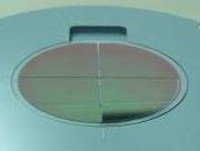 After the clamping of the thin wafer the wafer can be processed by several semiconductor tools that encapsulate the four contact pads at the backside from fluent or gaseous electrical conducting