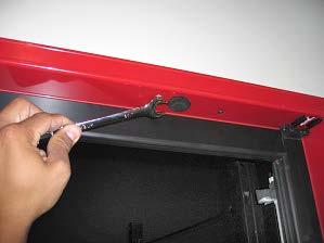 Release tension on TorqueMaster with a flat-head screwdriver.