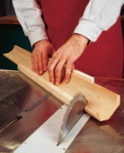The jig cradles the cove molding, preventing it from rocking while