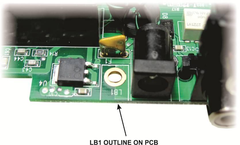 Locate the outline marked LB1 on the pc board. It is on the connector edge of the board next to the power connector (see Figure 10)
