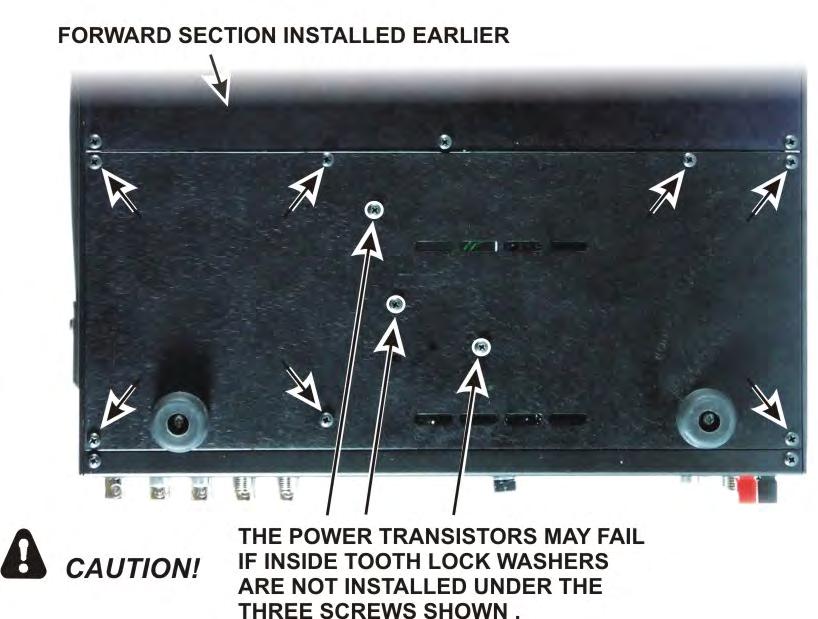 Install the rear bottom cover section as follows (see Figure 93): Position the cover so the holes near the center line up with the transistors on the LPA board.
