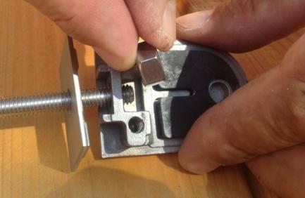 through hole in post, and put the other bracket onto the bolt Put the