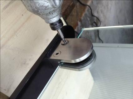 Take the other half of the brackets, slide onto installed halves, and tighten screws without stripping.