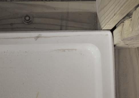 8. The next step is to dry fit the shower pan to check the fit to the studs and to the drain location.