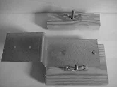 align paper tube bracket with the edge of the wood mounting plate (shown in diagram). II.