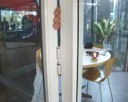 This will ensure that the panel does not strike the head of the door frame when the