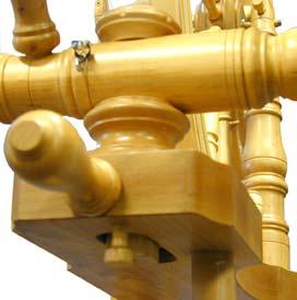 The footman with the larger top hole must be put in the rear position; this rear footman mounts on the brass bushing.