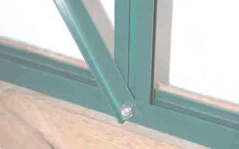 18. Take the free end of the diagonal strut and insert the bolt of the door support through the predrilled hole