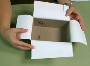 flaps. Fold the short flaps into the inside of the box to train the paper.