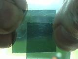 ) Transfer liquid crystal from the capillary tube to the space between the glass