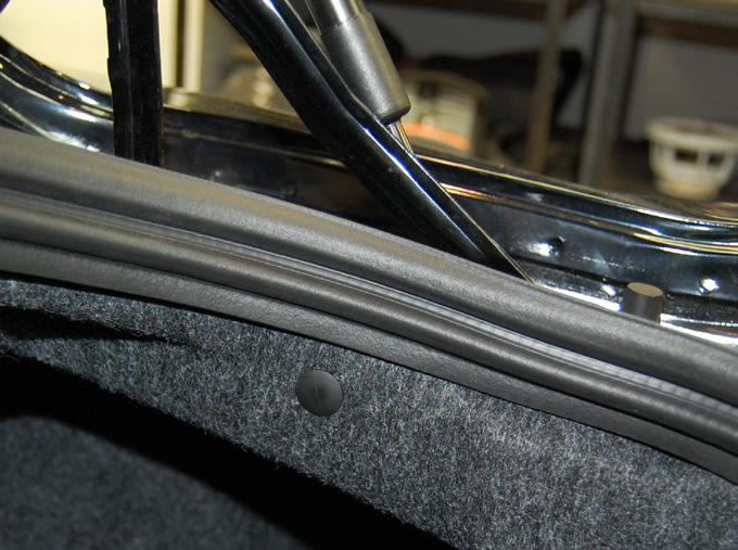 Pull the trunk liner away to gain access to the subwoofer enclosure